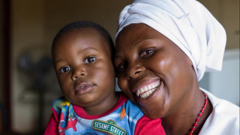 A healthy mother and child at a Zambian health care center. Photo Credit - UNICEF Zambia