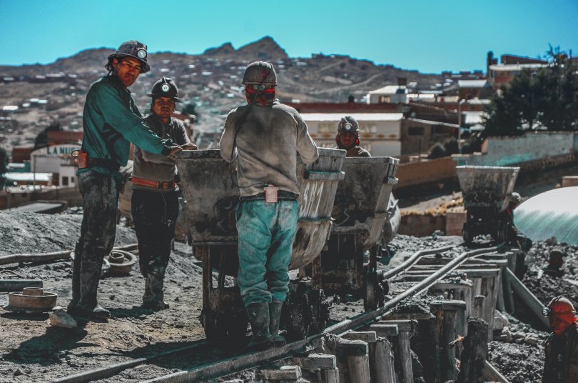 Miners in an open pit mine