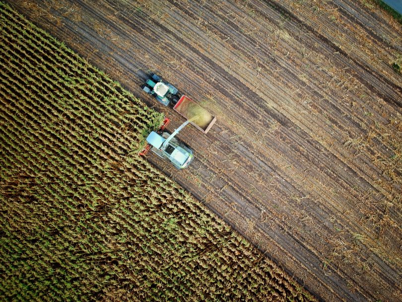 aerial view of a harvester in a field