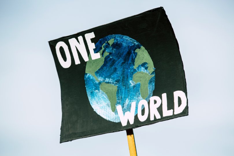 "One World" sign 
